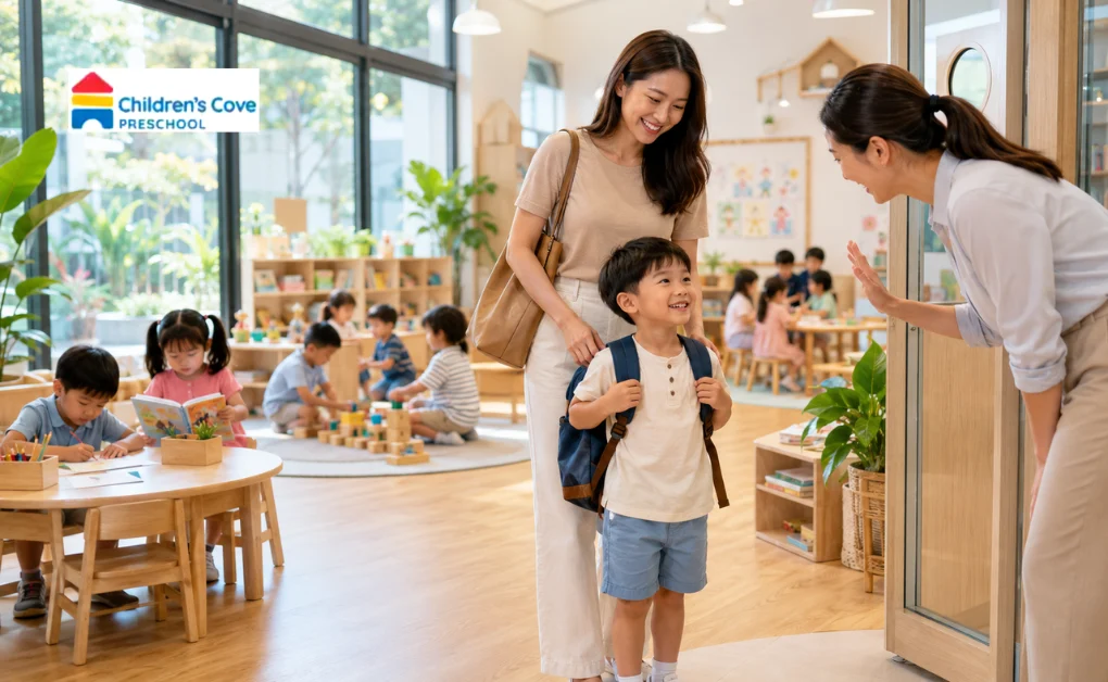 Mother dropping off child at ECDA preschool in Singapore as teacher welcomes him at classroom entrance